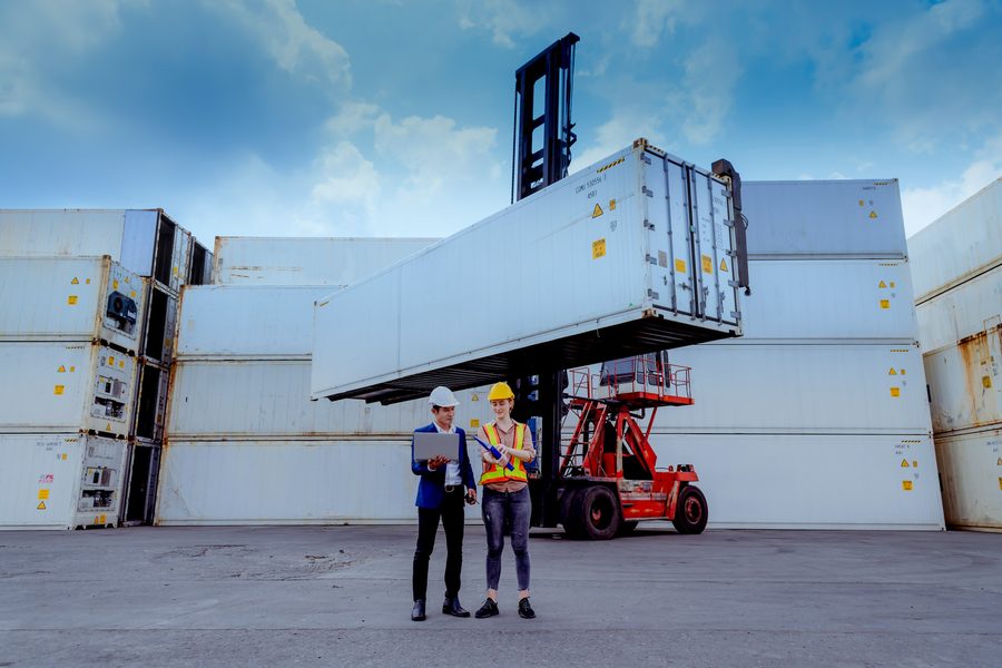 Logistics workers reviewing operations at a port